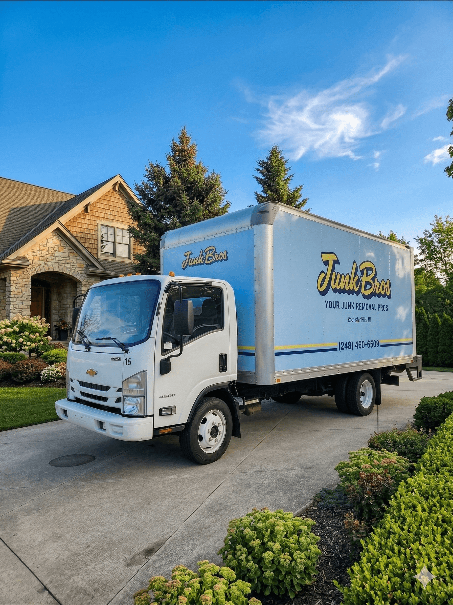 The Junk Bros box truck parked in a Metro Detroit driveway